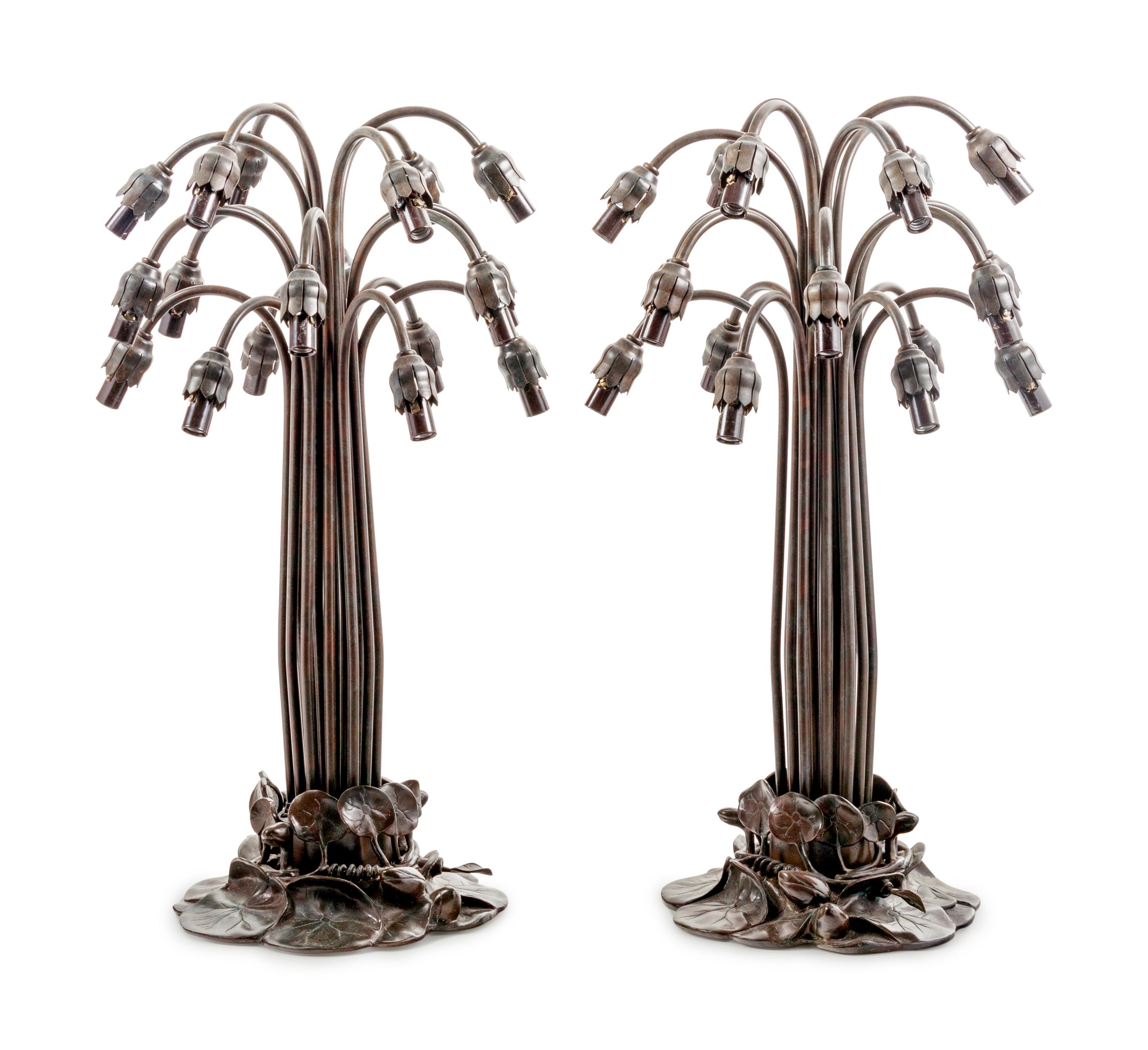 A Pair of Art Nouveau Style Patinated Metal and Iridescent Glass Eighteen-Light Tulip Lamps