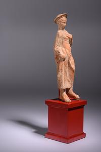 A Greek Terracotta Woman Wearing a Polos (broad-rimmed hat)