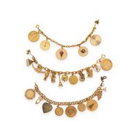 COLLECTION OF YELLOW GOLD CHARM BRACELETS