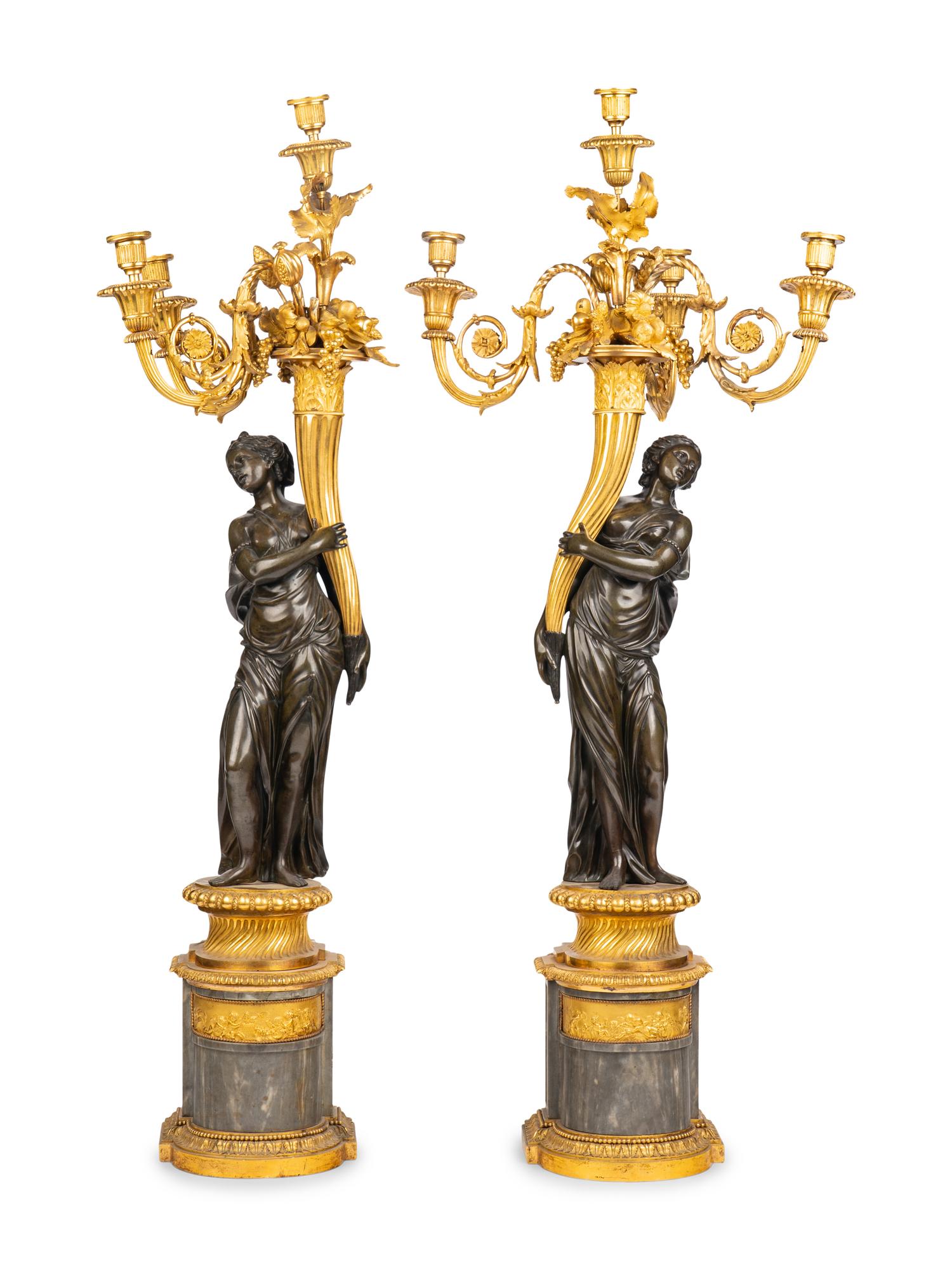 A Pair of Louis XVI Gilt and Patinated Bronze Four-Light Candelabra