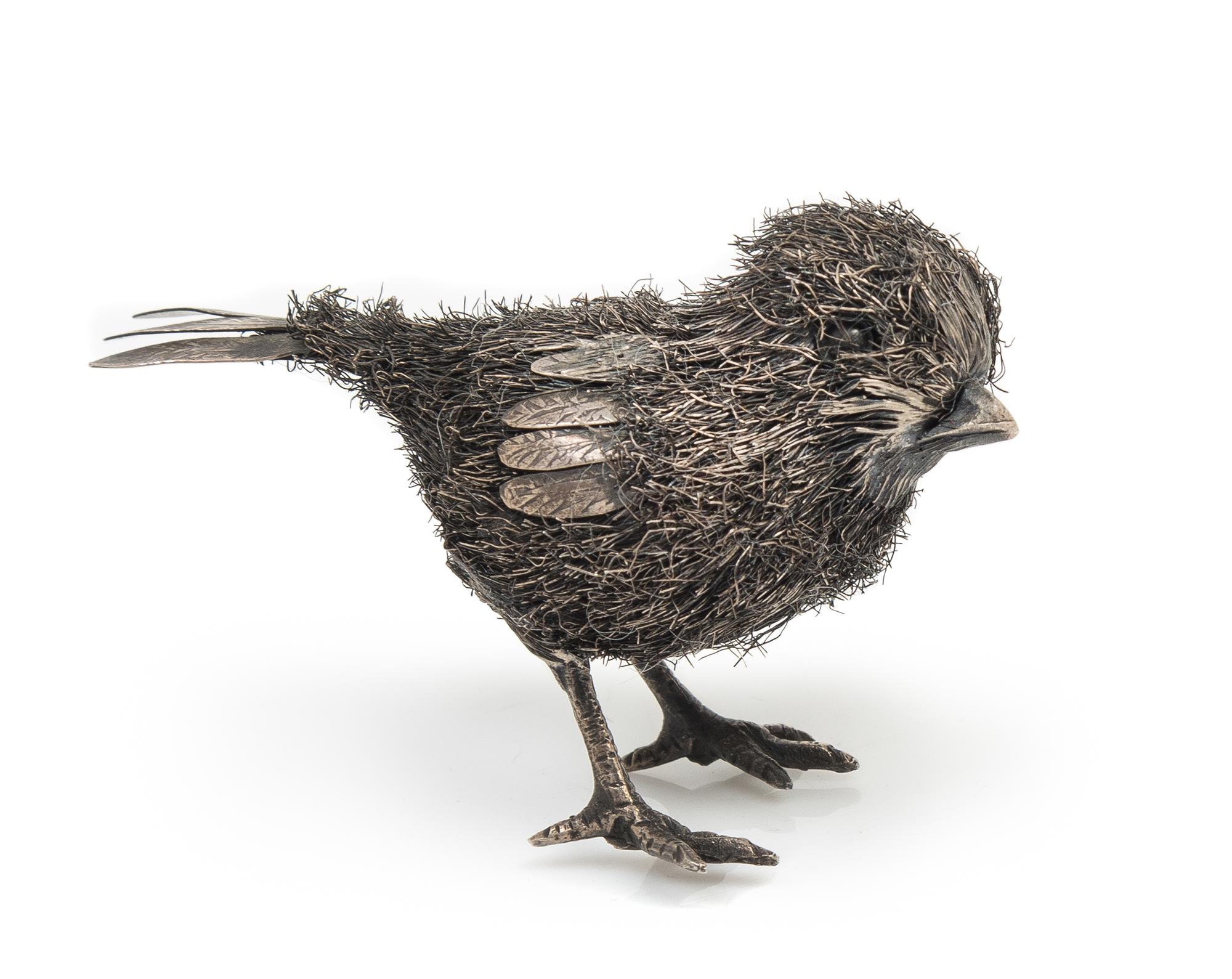 An Italian Silver Chick, Buccellati, Florence, 20th Century, the body formed of silver wire with a silver sheet wing and tail.