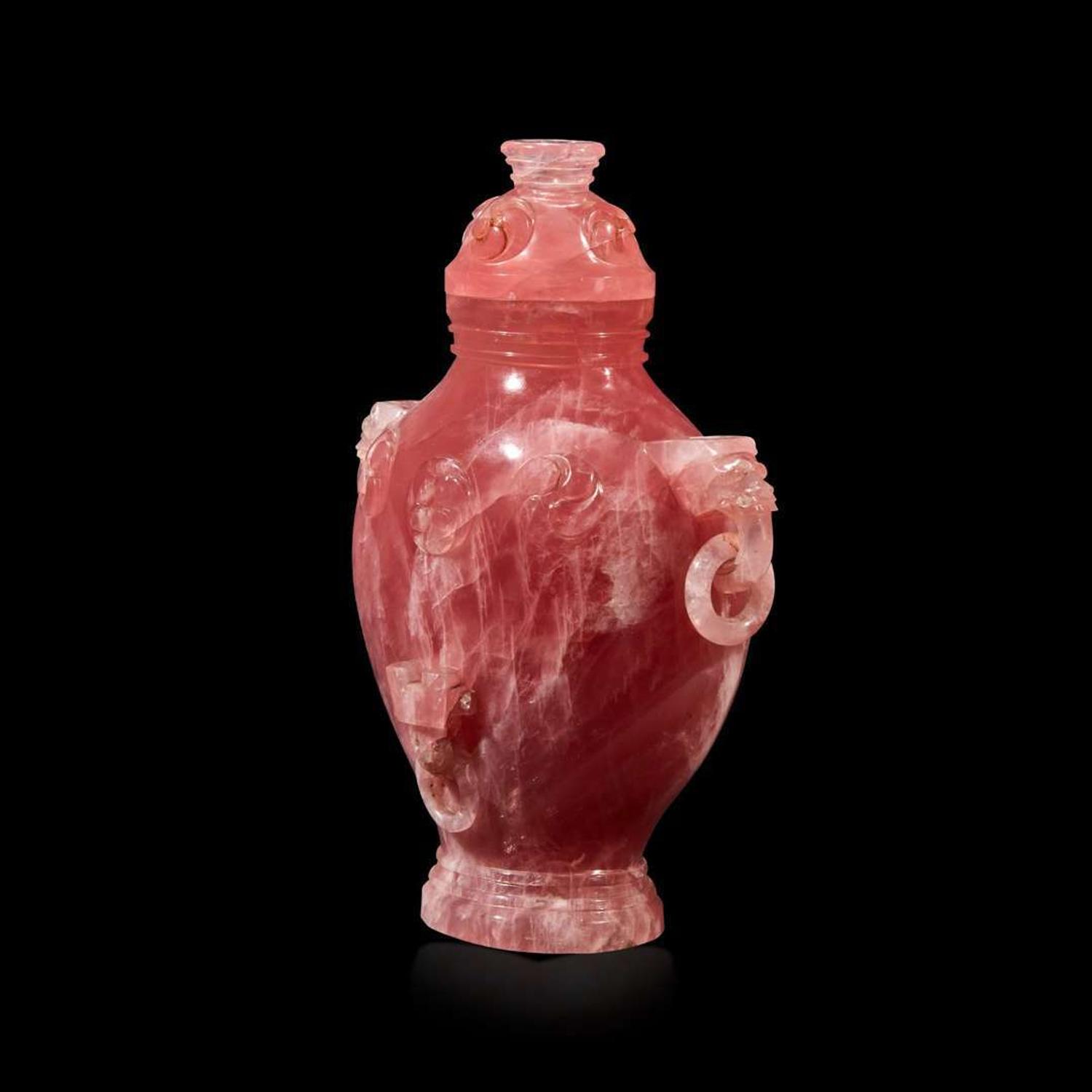 A Chinese carved rose quartz archaistic vase and cover