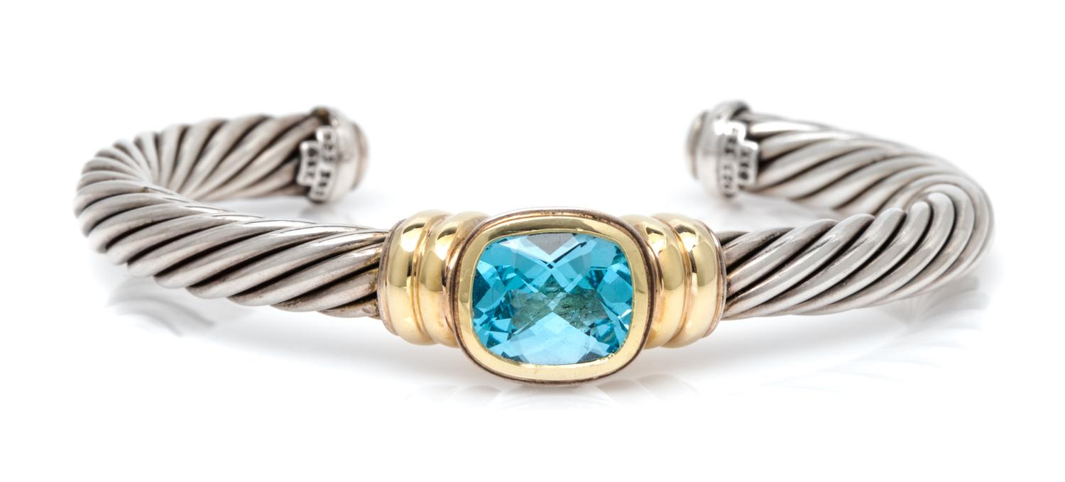 A Sterling Silver, 14 Karat Yellow Gold, and Blue Topaz 'Noblesse' Cuff Bracelet, David Yurman, 31.50 dwts.