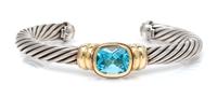 A Sterling Silver, 14 Karat Yellow Gold, and Blue Topaz 'Noblesse' Cuff Bracelet, David Yurman, 31.50 dwts.