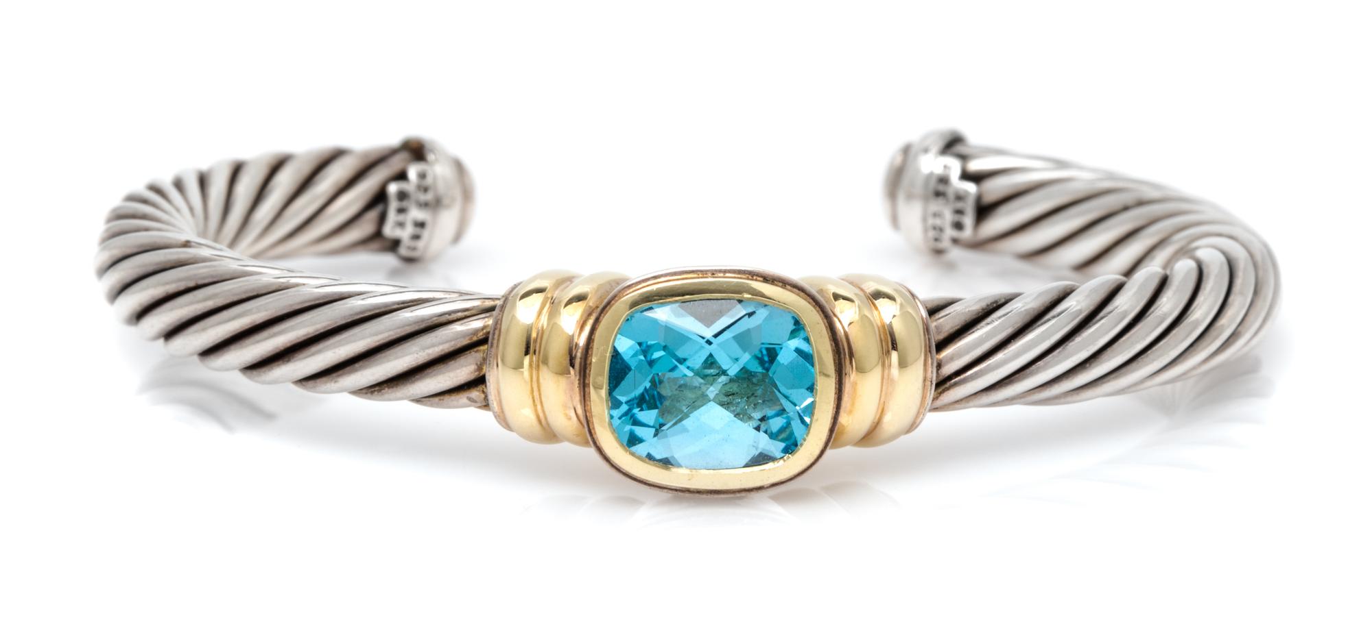 A Sterling Silver, 14 Karat Yellow Gold, and Blue Topaz 'Noblesse' Cuff Bracelet, David Yurman, 31.50 dwts.