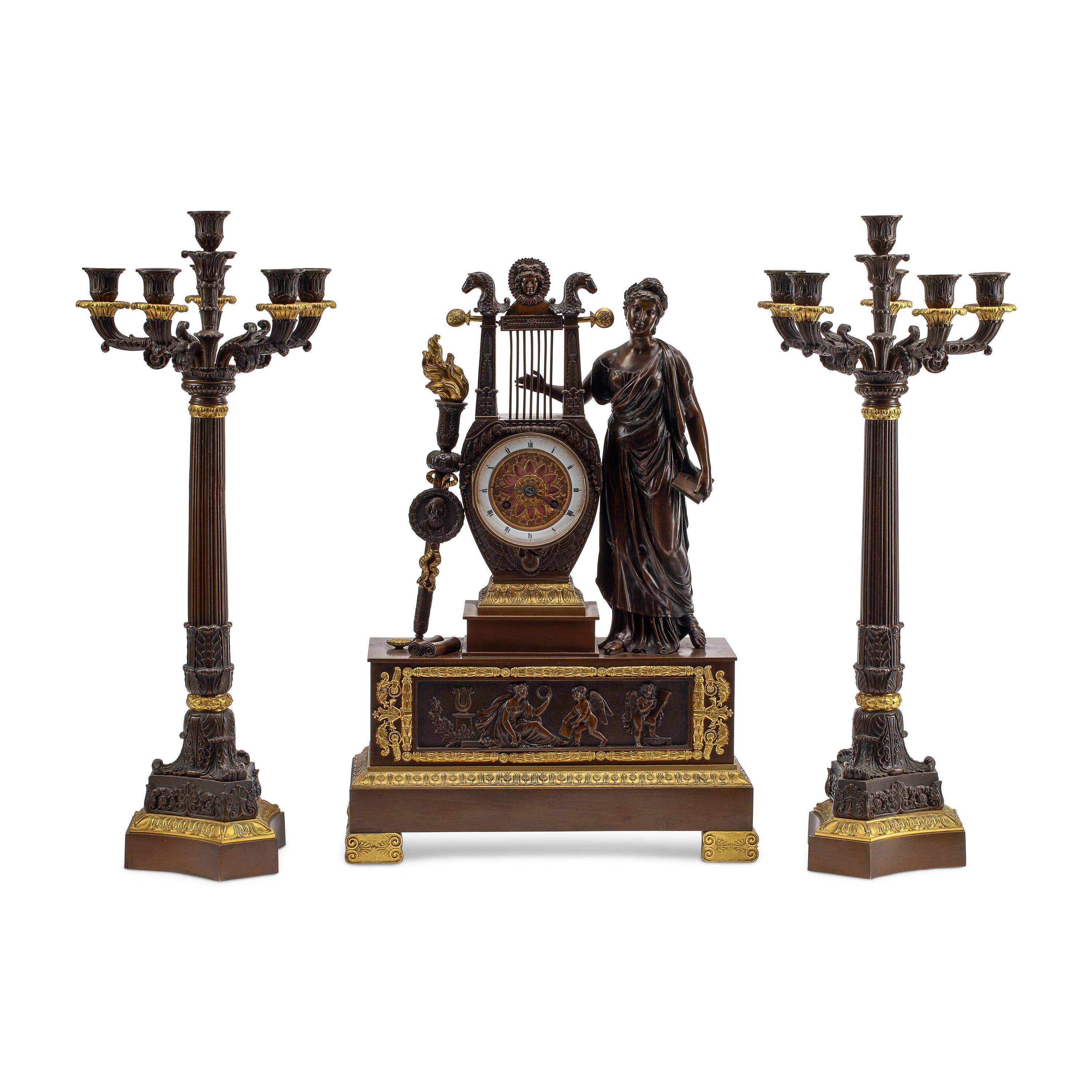 An Empire Style Gilt and Patinated Three-Piece Clock Garniture