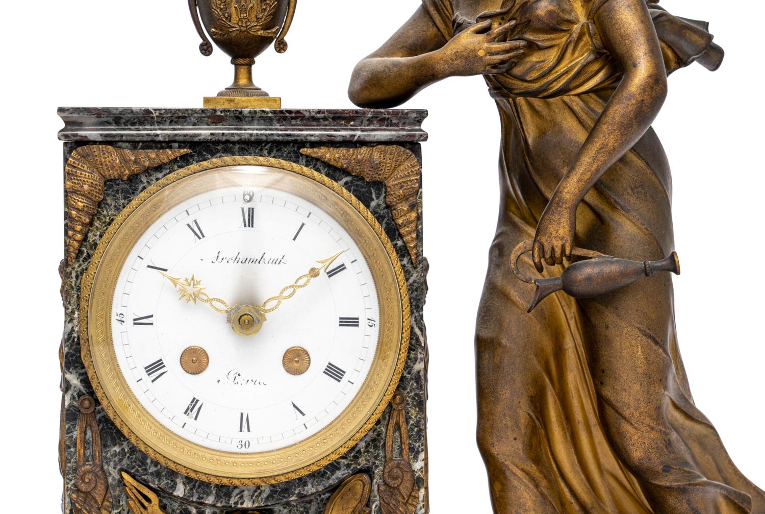 An Empire Style Gilt Metal and Marble Figural Mantel Clock
