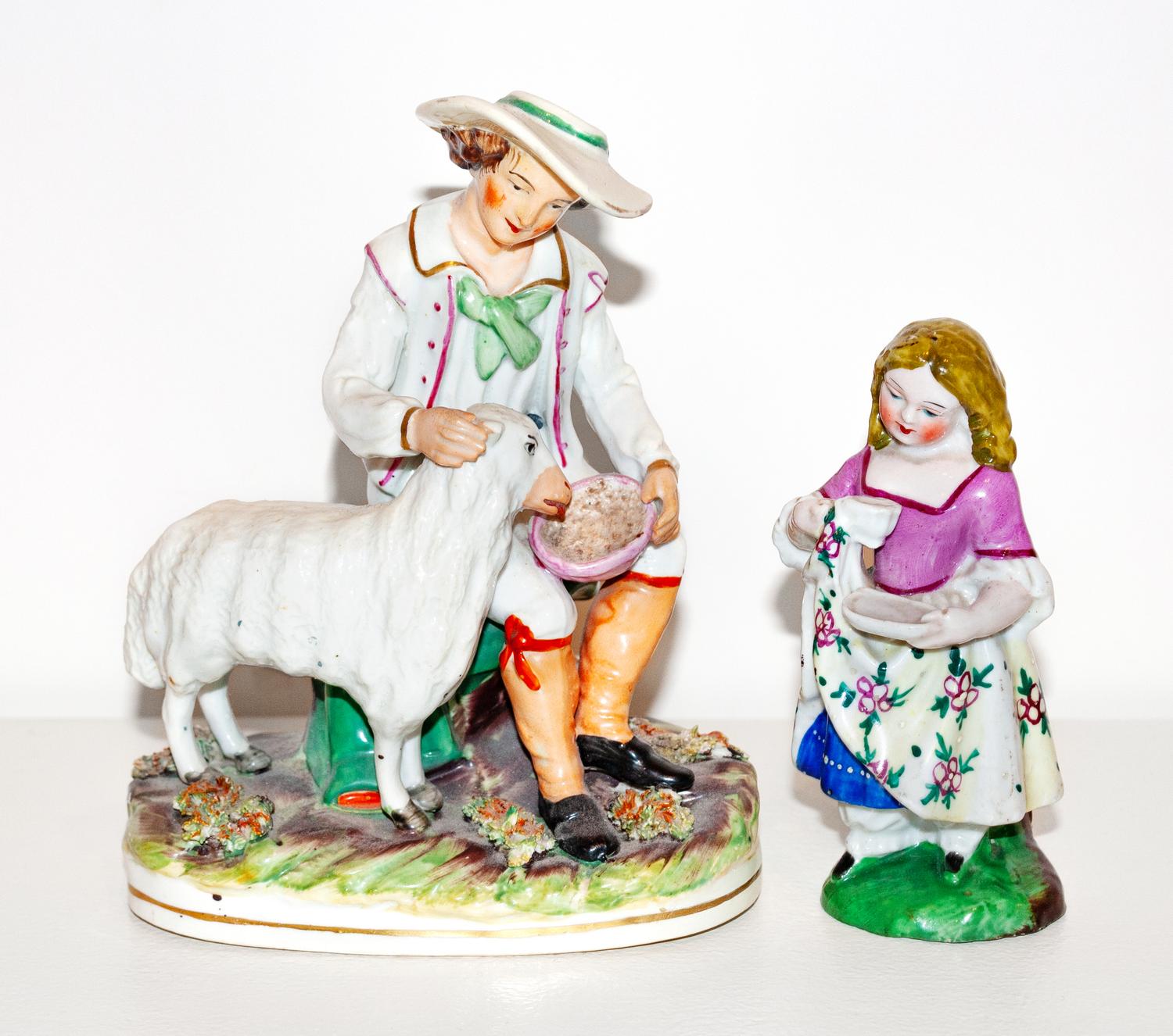A Staffordshire Porcelain Figure of a Seated Shepherd and a Figure of a Girl