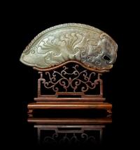 A Large Russet and Celadon Jade Phoenix-Form Plaque