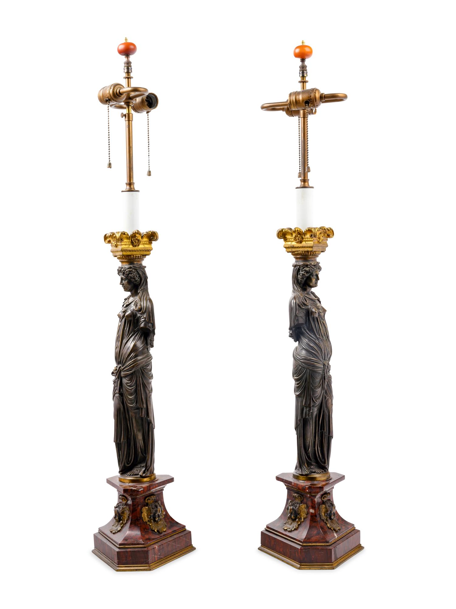 A Pair of French Neoclassical Gilt and Patinated Bronze Figural Lamps After Jean Goujon