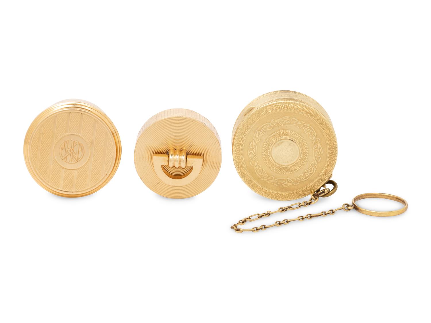 Two Cartier Gold Pill Boxes and Another Gold Pill Box