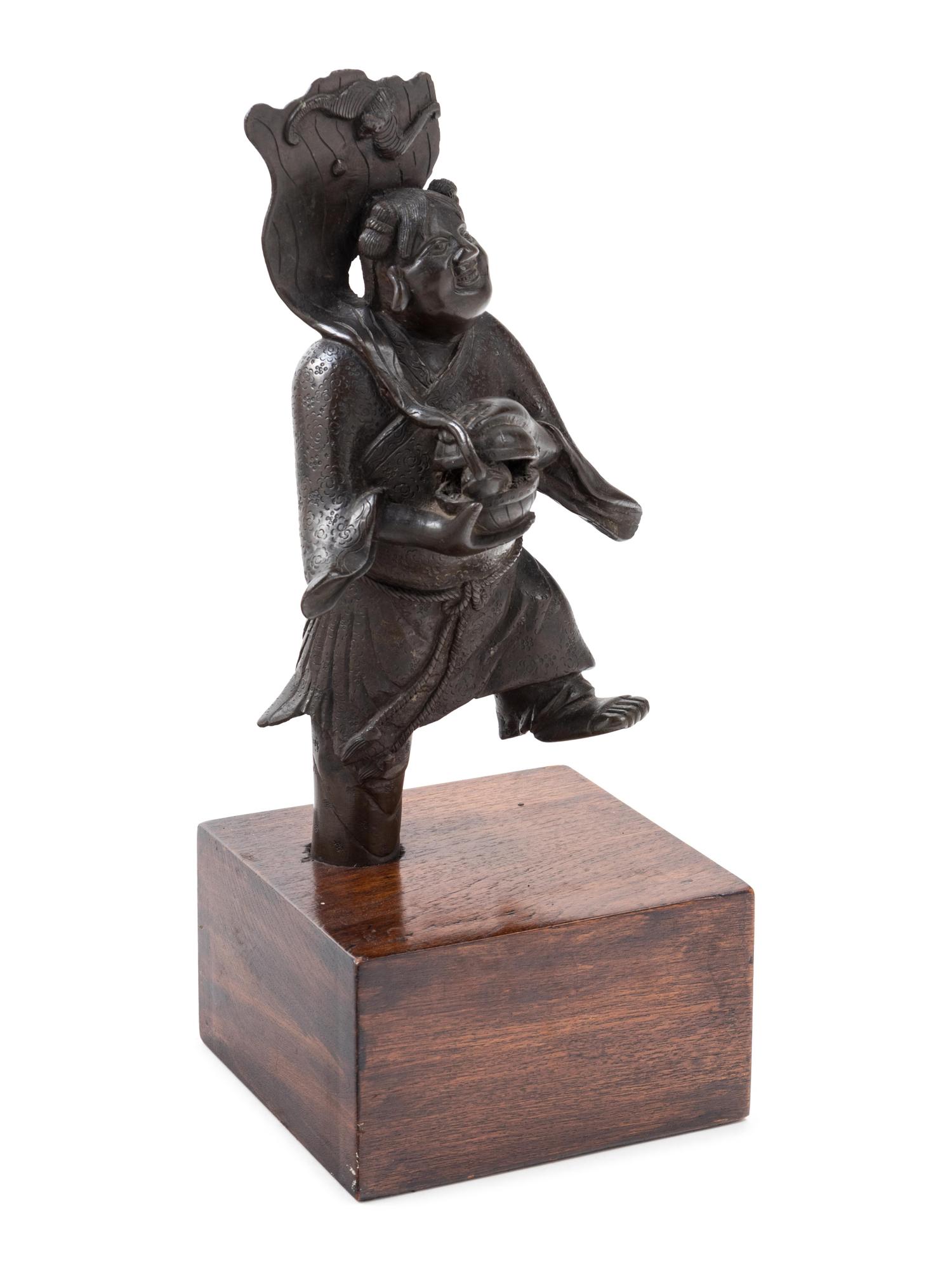 A Chinese Bronze Figure of a Boy Immortal
