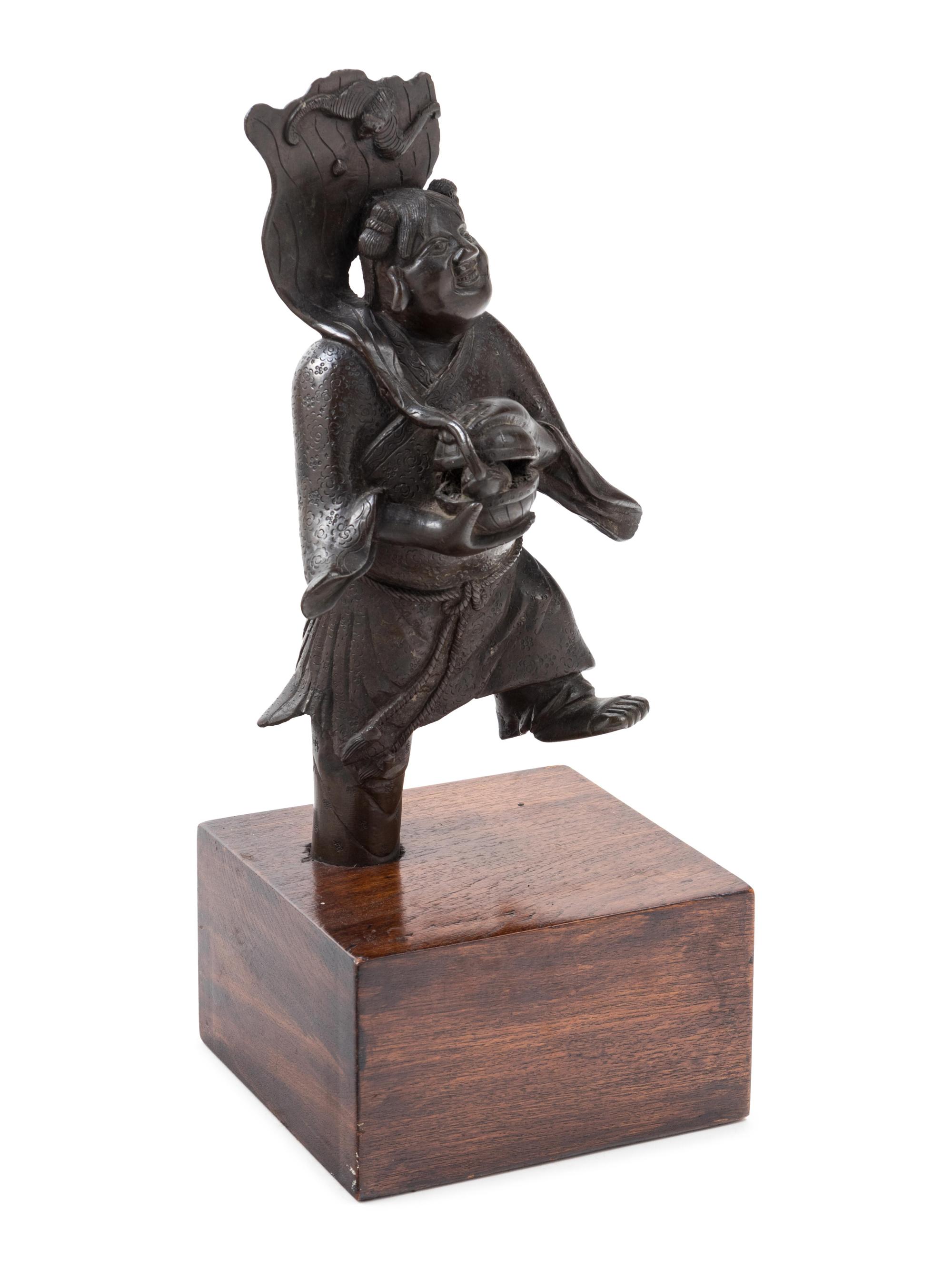 A Chinese Bronze Figure of a Boy Immortal