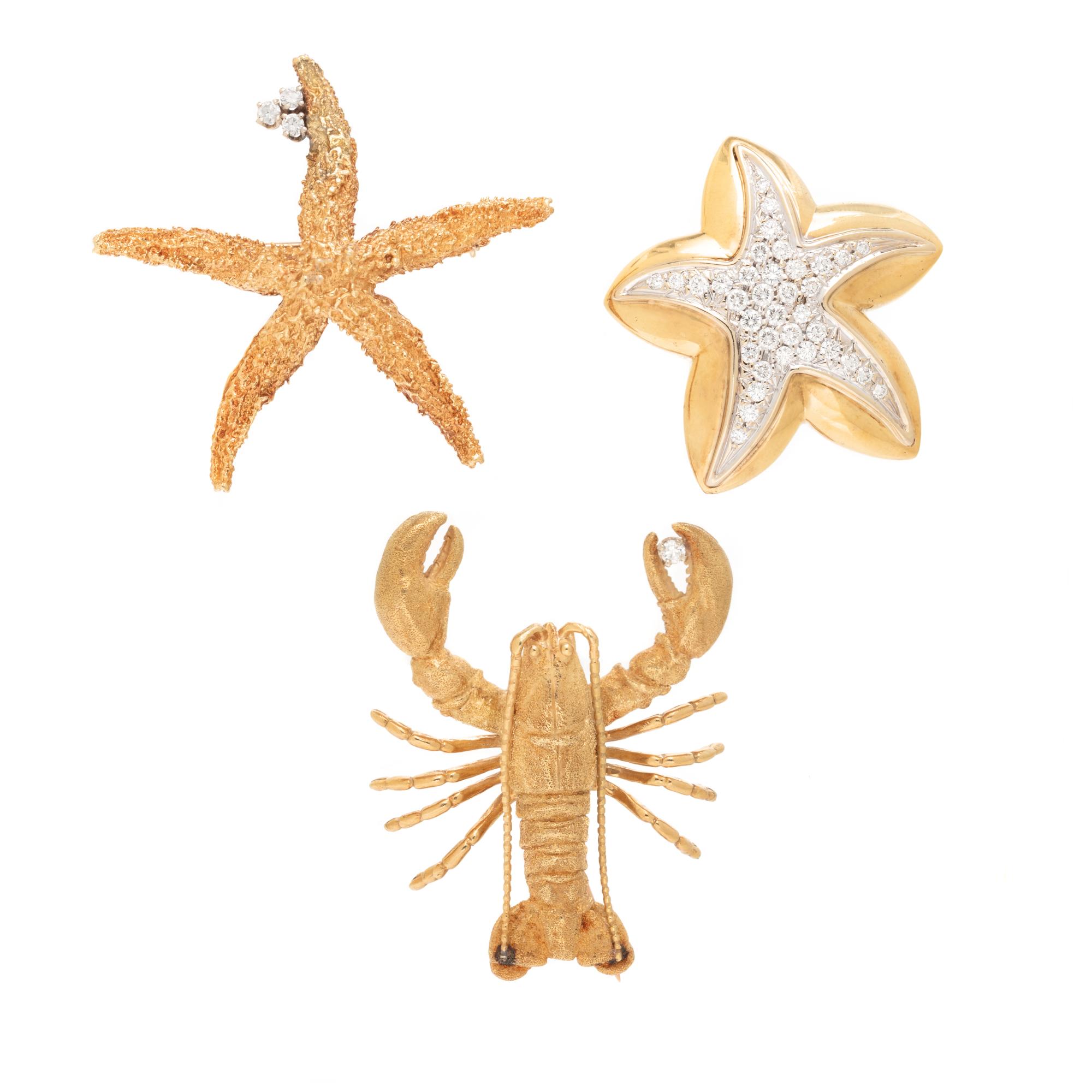 COLLECTION OF YELLOW GOLD SEASHORE BROOCHES