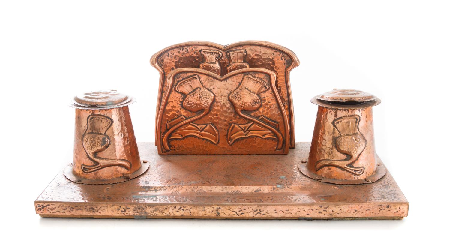 An Arts and Crafts Hammered Desk Stand Width 12 inches. — EARLY 20TH CENTURY