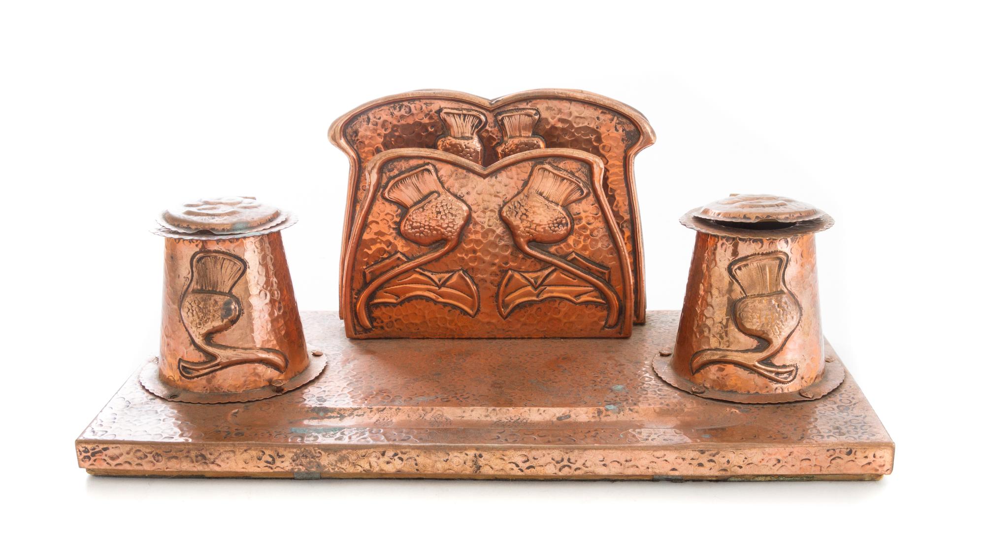 An Arts and Crafts Hammered Desk Stand Width 12 inches. — EARLY 20TH CENTURY