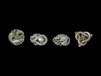 Four Chinese Celadon Jade Carved 'Animal' Pendants