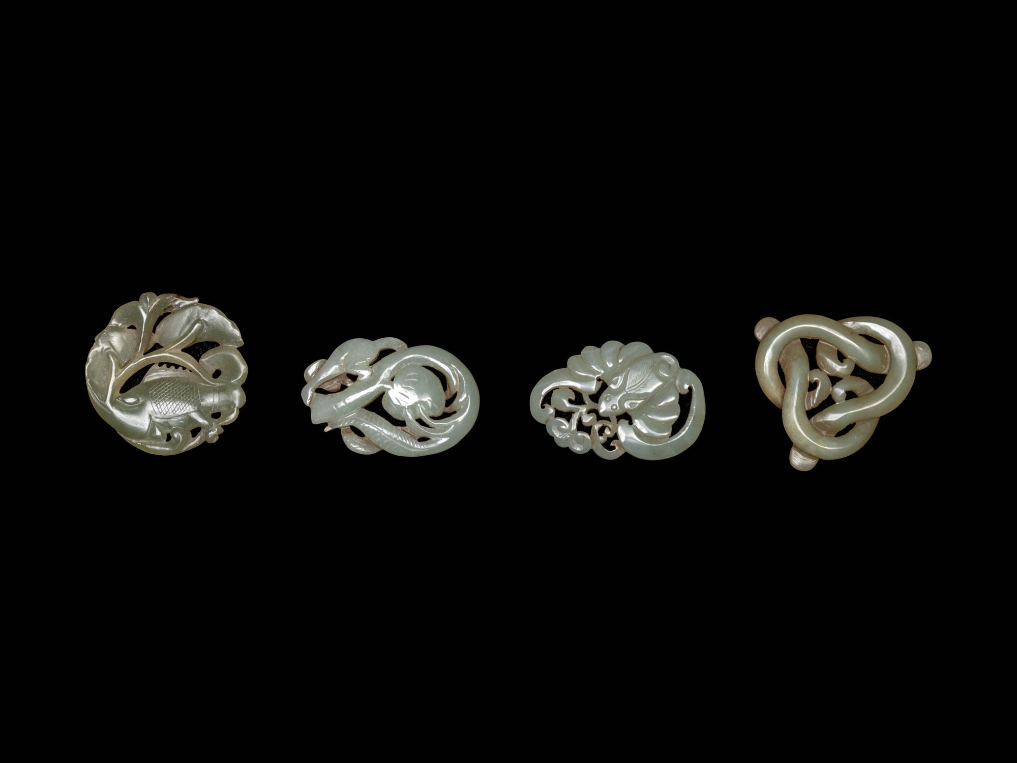 Four Chinese Celadon Jade Carved 'Animal' Pendants
