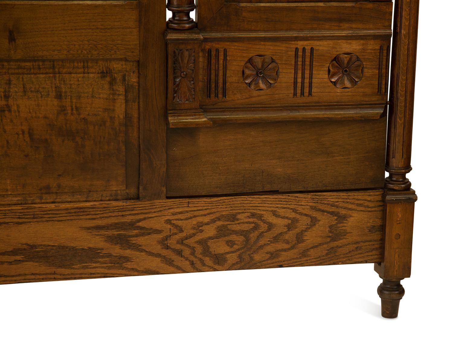 A Renaissance Revival Carved Oak Headboard