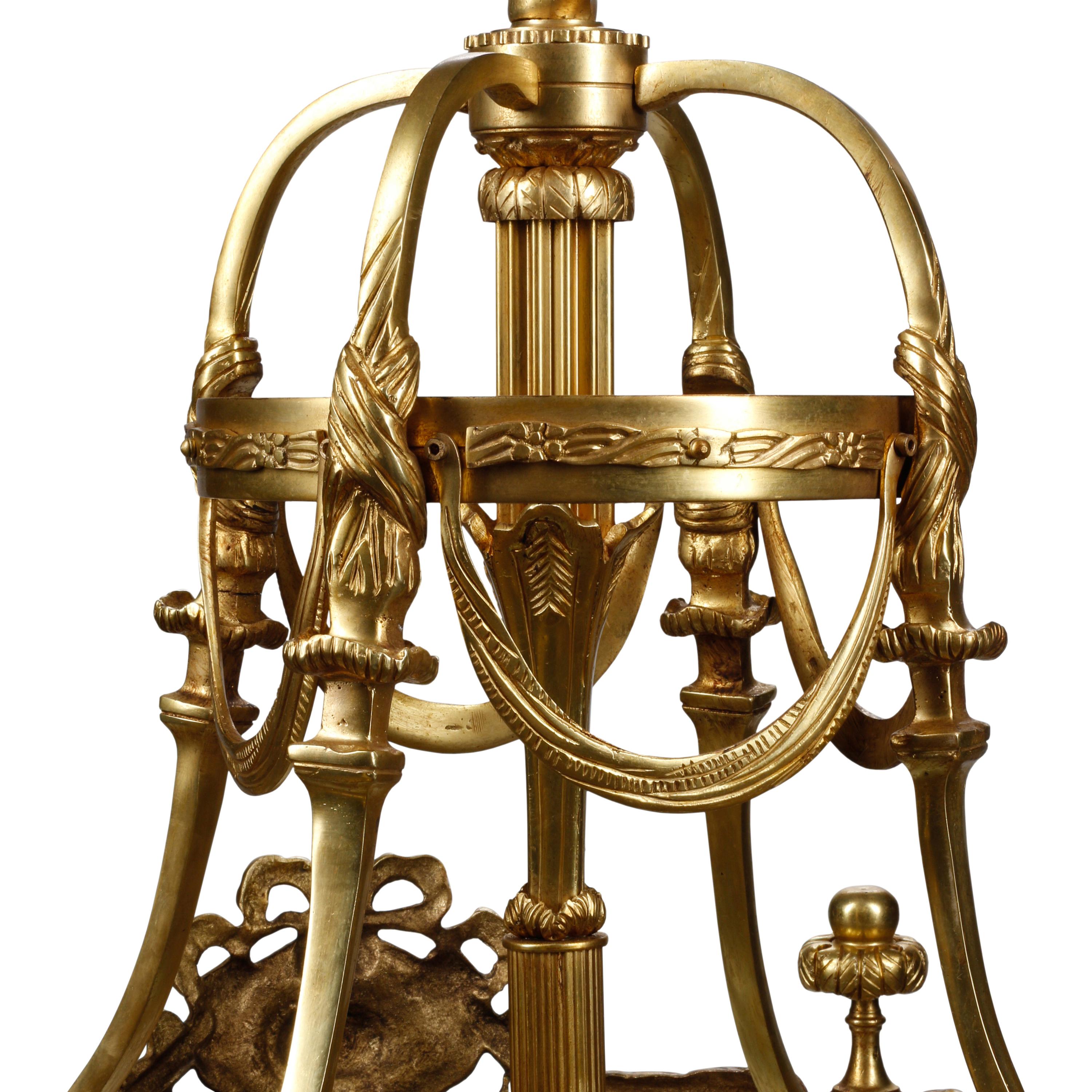 A Pair of Louis XVI Style Gilt Bronze and Mahogany Hall Lanterns