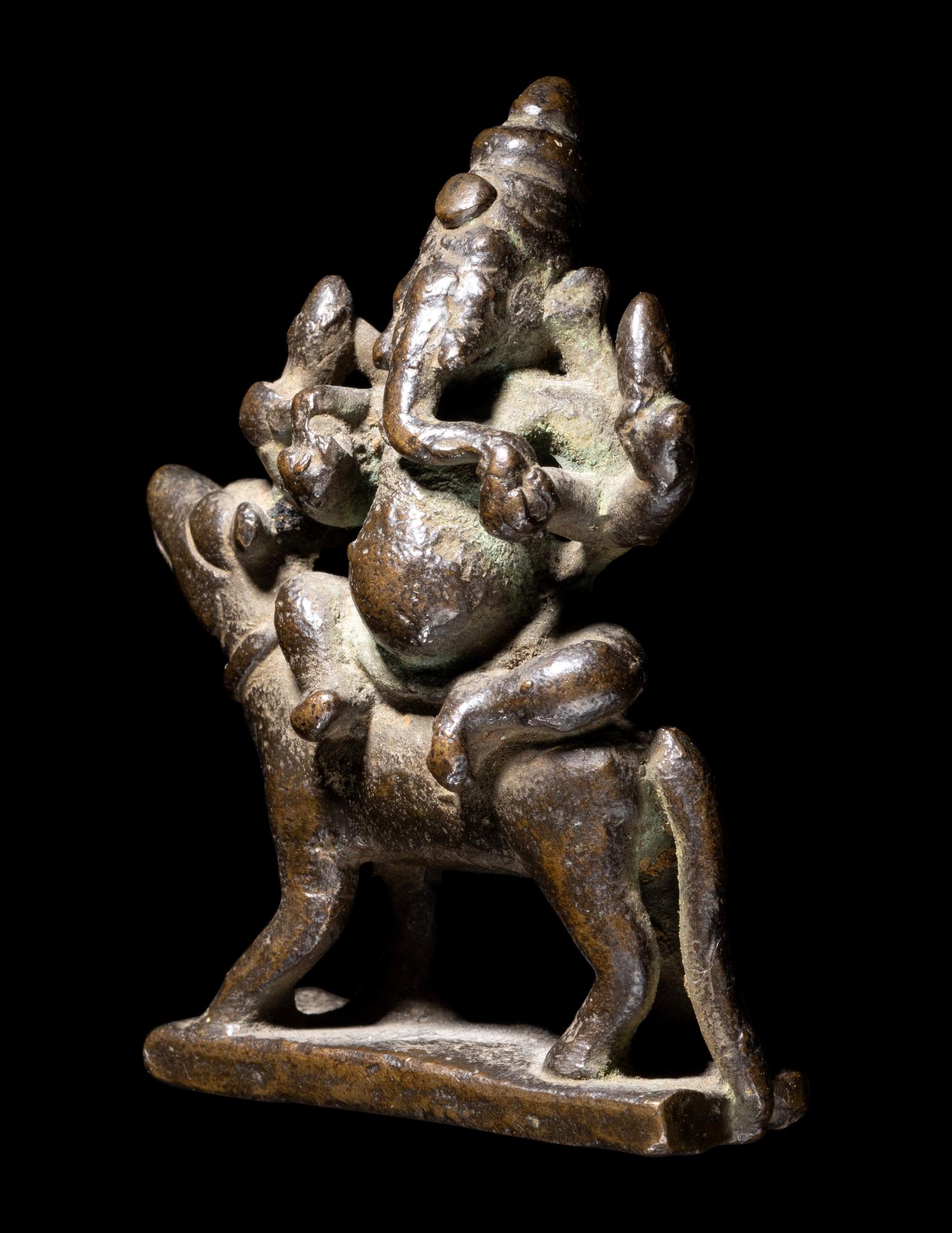 An Indian Bronze Figure of Ganesha Mounted
