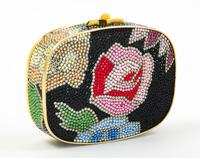 A Judith Leiber Black Floral Minaudiere, 3.75"H x 5"W x 1"D; Strap drop: 19.5".