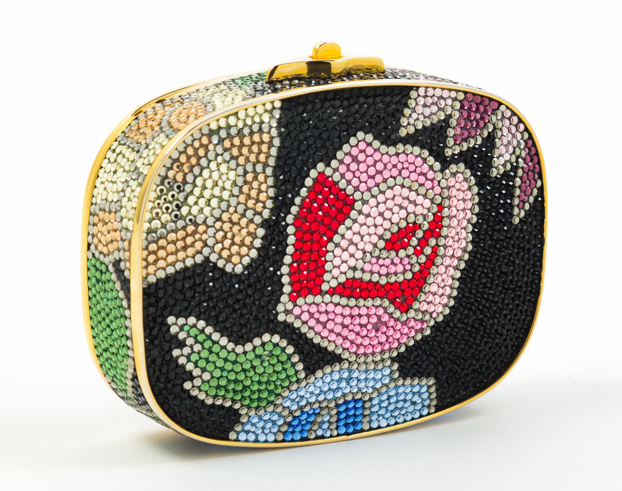 A Judith Leiber Black Floral Minaudiere, 3.75"H x 5"W x 1"D; Strap drop: 19.5".