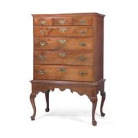 A Queen Anne Carved Walnut Chest-on-Frame
