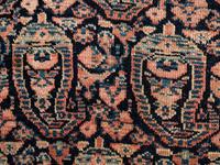A Persian Senneh Wool Rug