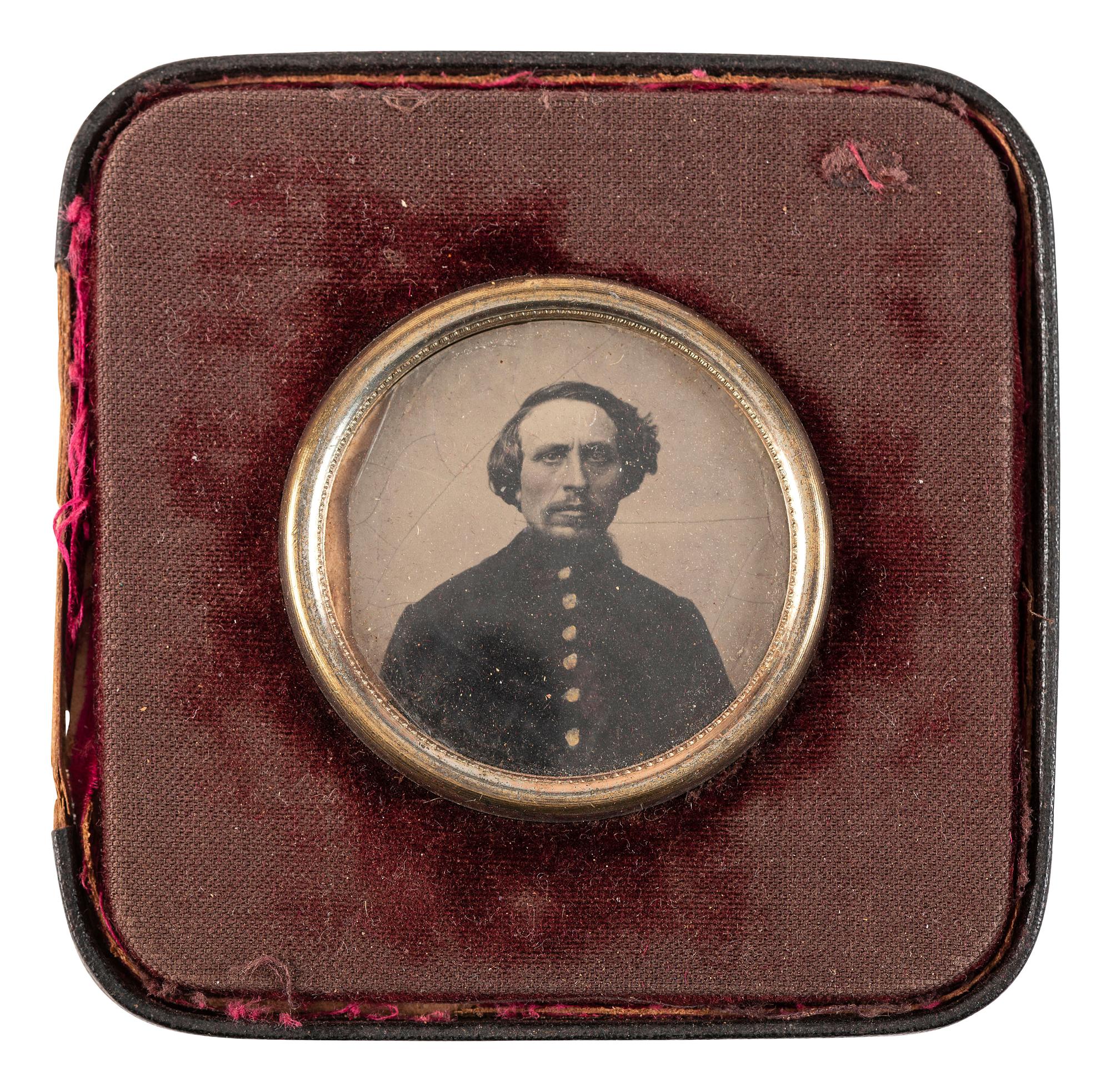 [CIVIL WAR]. A group of 3 tintypes of soldiers, incl. portrait of an armed soldier and portraits of soldier and wife housed in locket.