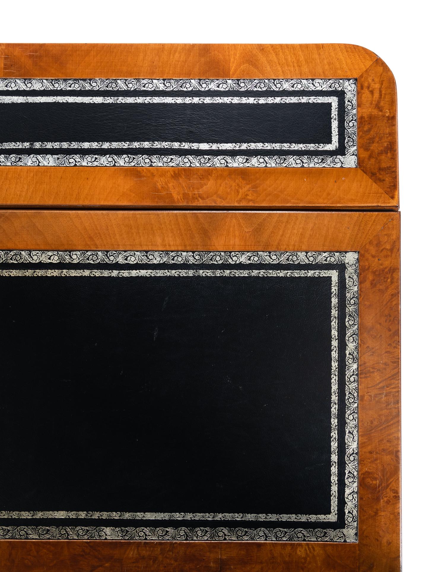 A Regency Style Parcel-Gilt and Part-Ebonized Mahogany Sofa Table