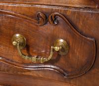 A Louis XV Provincial Carved Walnut Commode