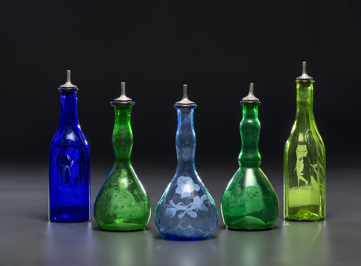 Five Green and Cobalt 'Mary Gregory' Glass Barber Bottles