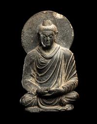 A Gandharan Grey Schist Figure of Seated Buddha