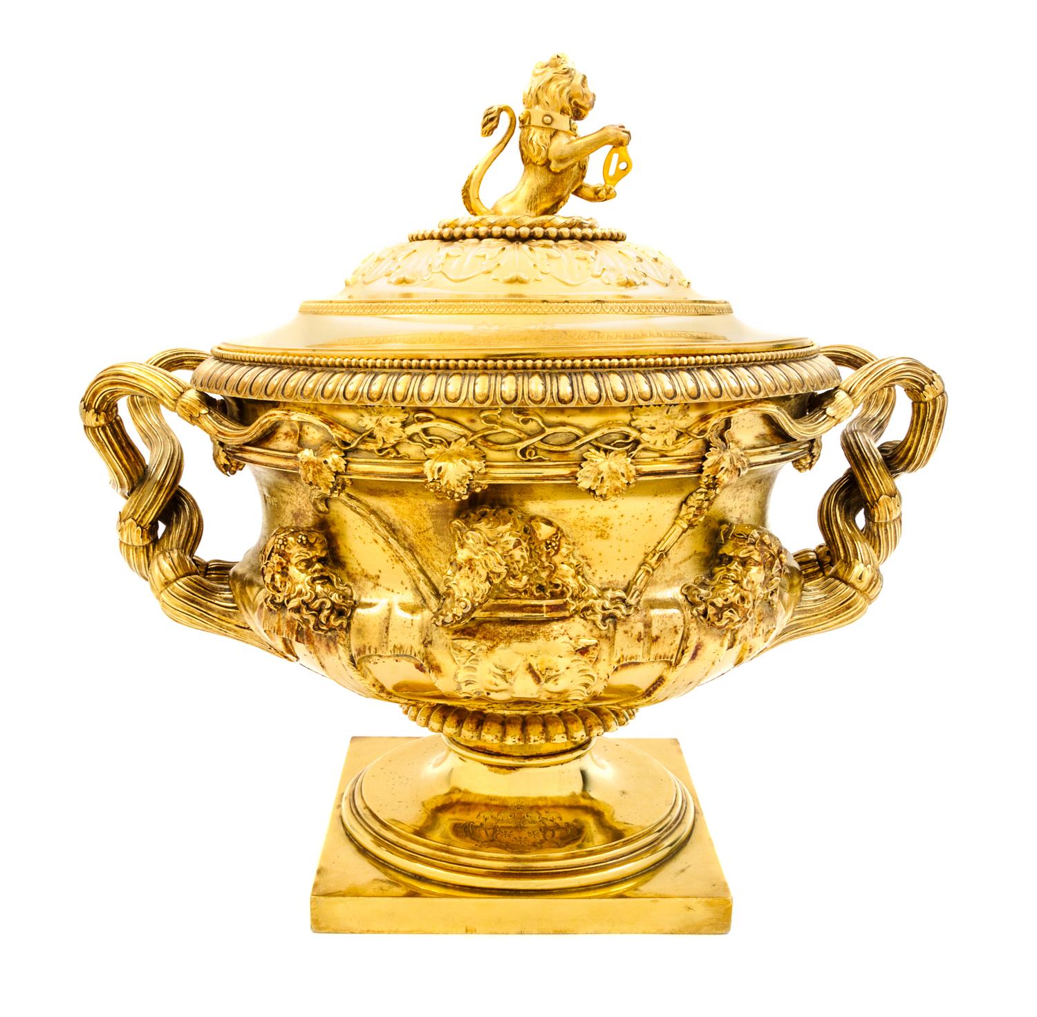 A George III Silver-Gilt Tureen, Benjamin Smith II & Benjamin Smith III, London, 1817, modeled after the Warwick vase, the lid with a l
