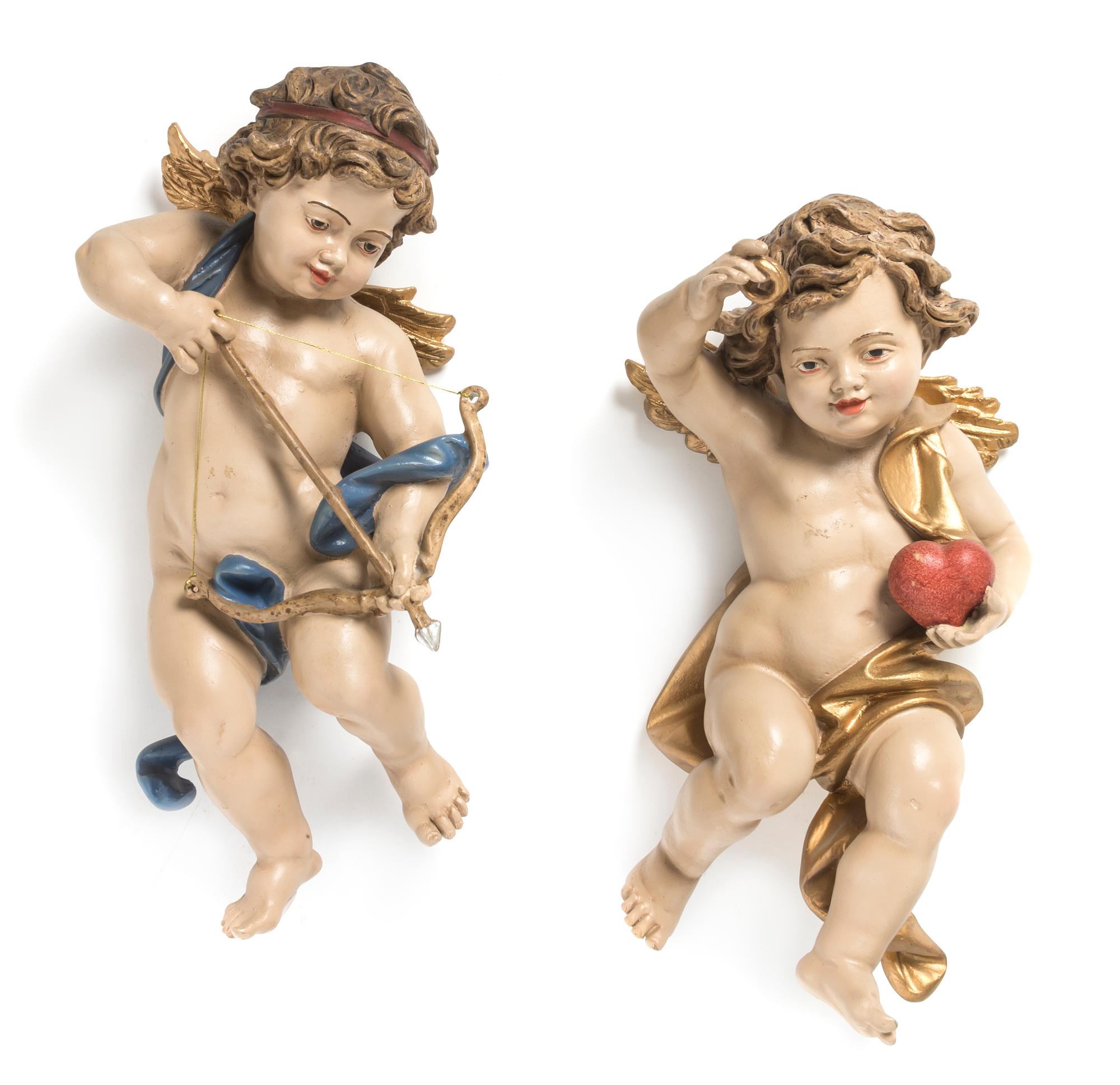 A Pair of Continental Painted and Parcel Giltwood Figures, Height 15 inches.