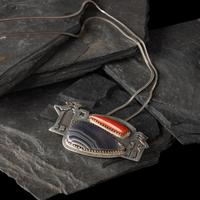 Gail Bird and Yazzie Johnson (Kewa-Laguna, b. 1949) / (Diné, b. 1946) — Figural Pendant with Multi-stone Inlay