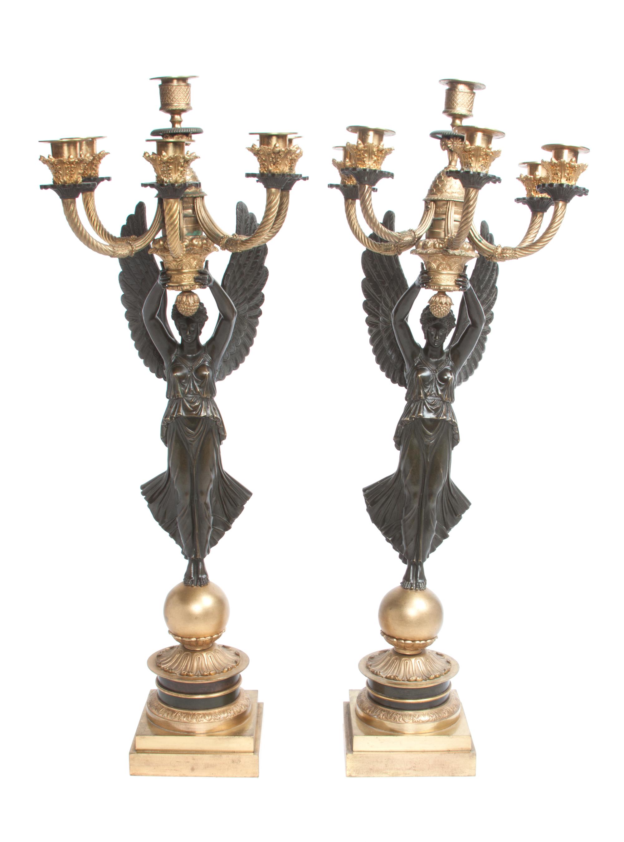 A Pair of Gilt and Patinated Bronze Six-Light Figural Candelabra