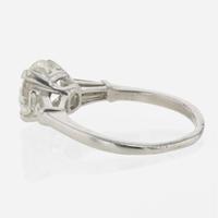 A diamond accented solitaire ring