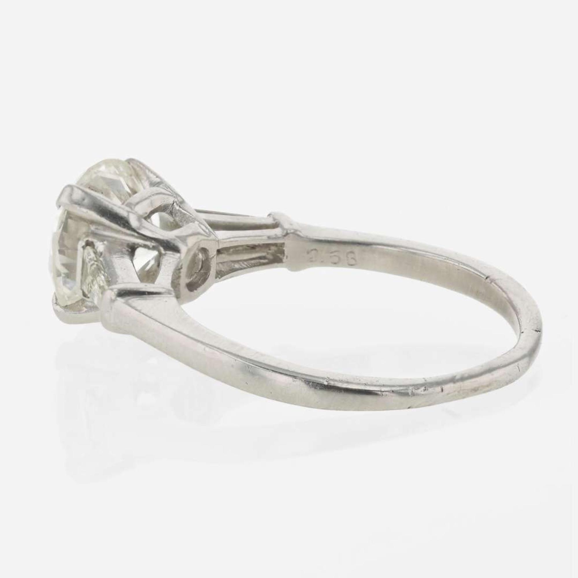 A diamond accented solitaire ring