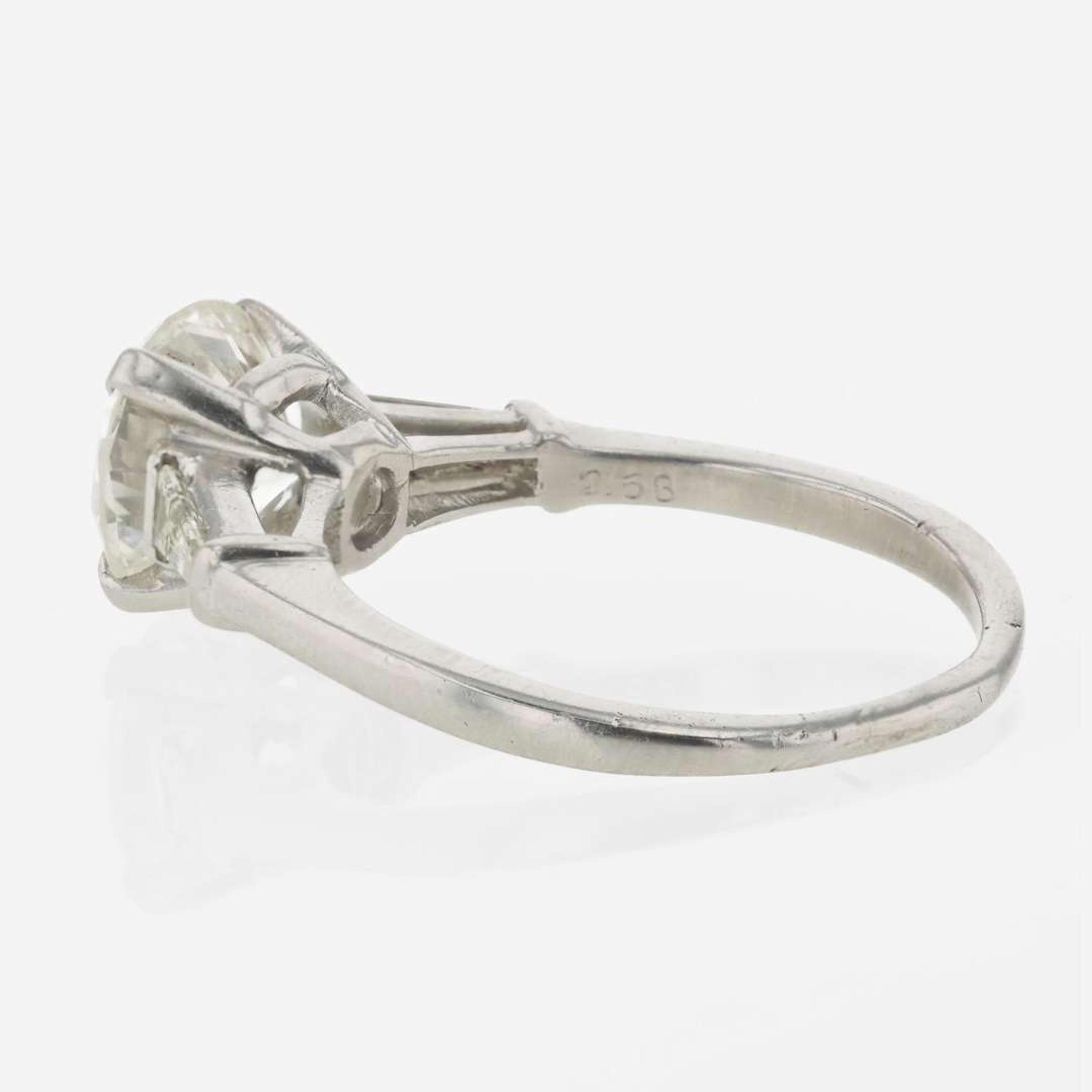 A diamond accented solitaire ring