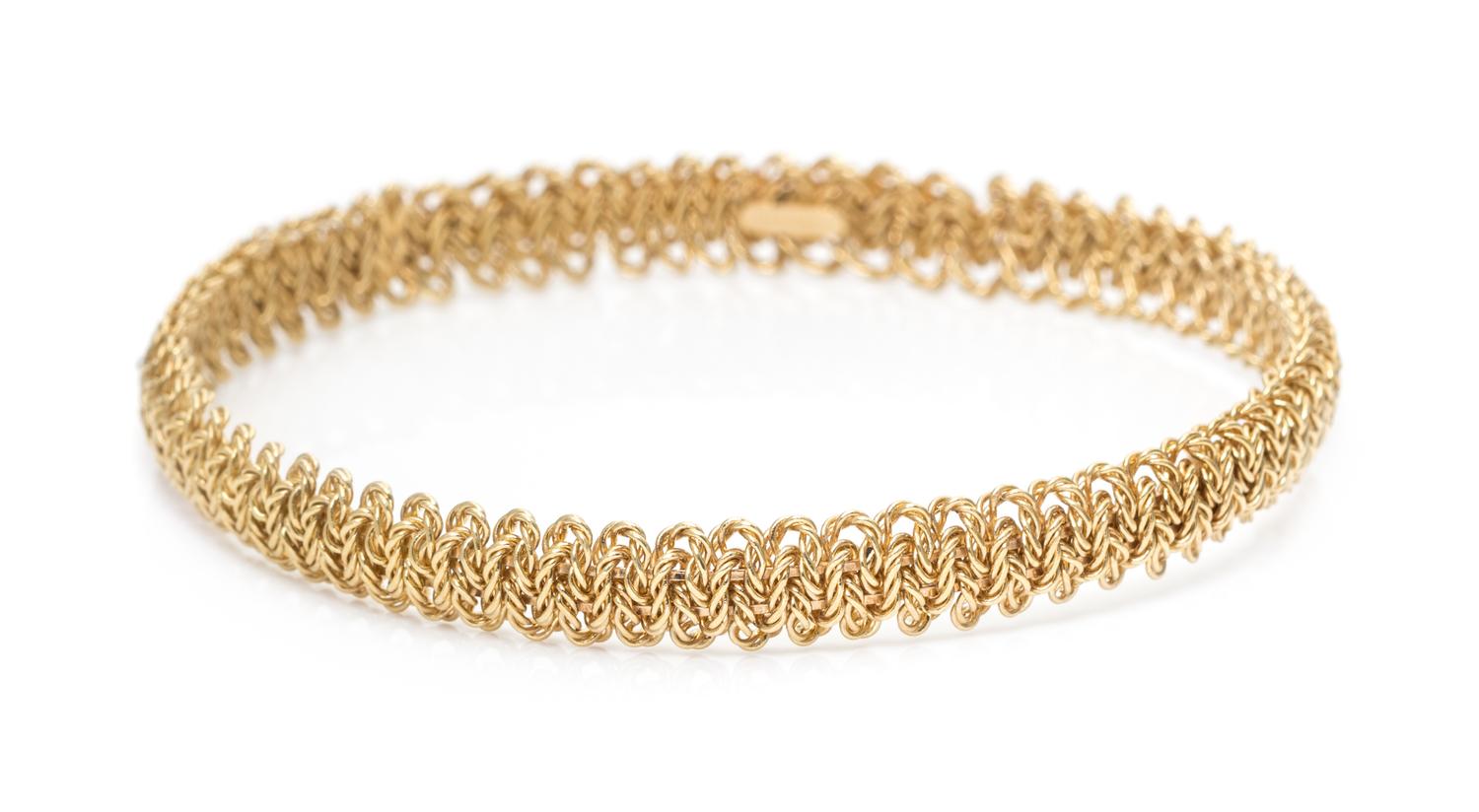 An 18 Karat Yellow Gold Bangle Bracelet, Tiffany & Co., France, 15.00 dwts.