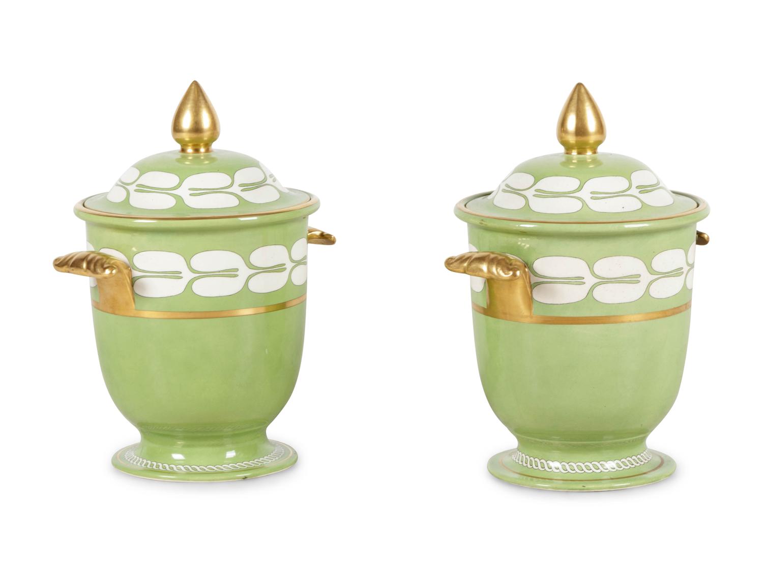 A Pair of Porcelain Covered Urns