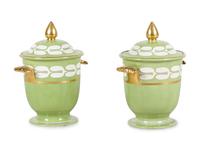 A Pair of Porcelain Covered Urns