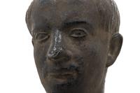A Cast Metal Bust of a Man