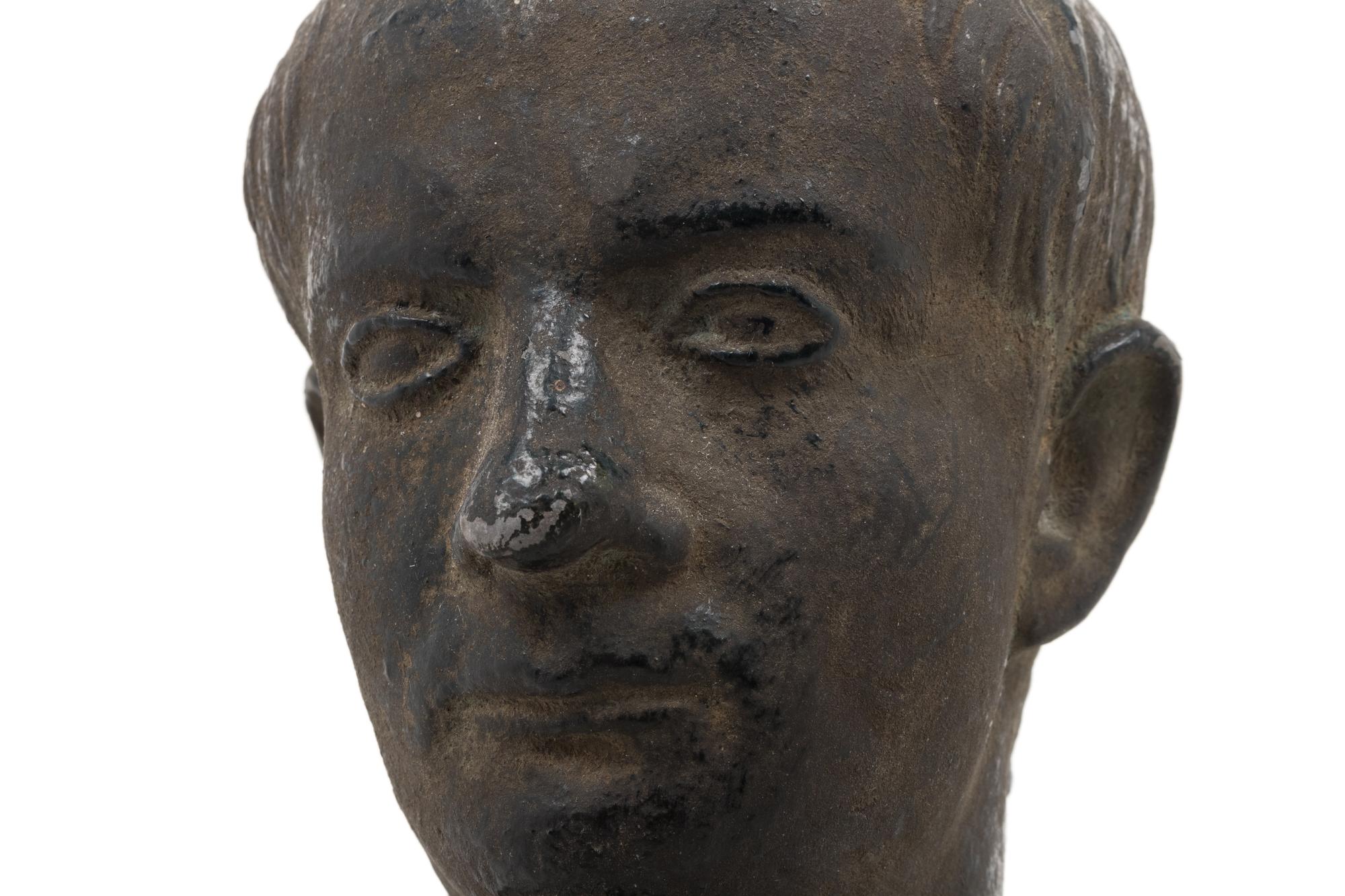 A Cast Metal Bust of a Man