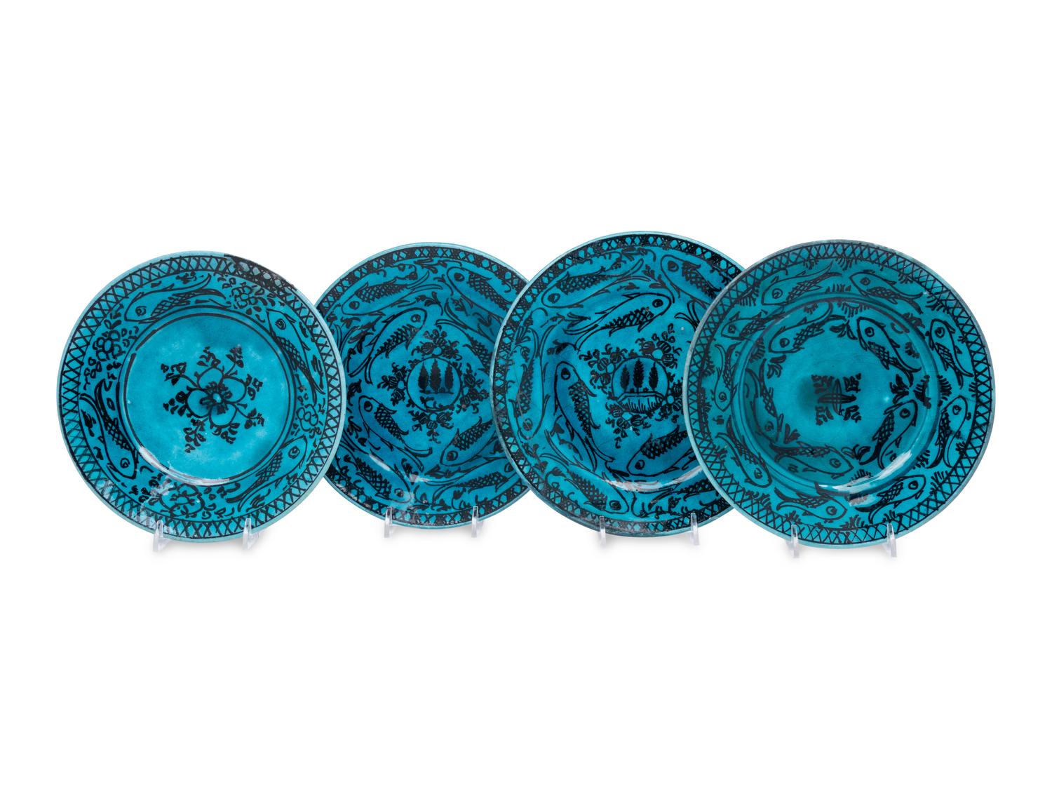 A Set of Four Persian Turquoise Glazed Earthenware Plates