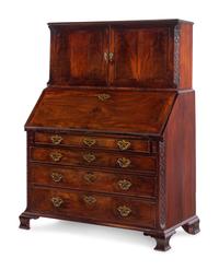 A George III Carved Mahogany Slant-Front Secretary Desk in the Chippendale Taste