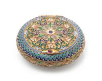 A Russian Enameled Silver Snuff Box, Mark of 11th Artel, Moscow, early 20th century, of circular form, the case having a gilt wash grou