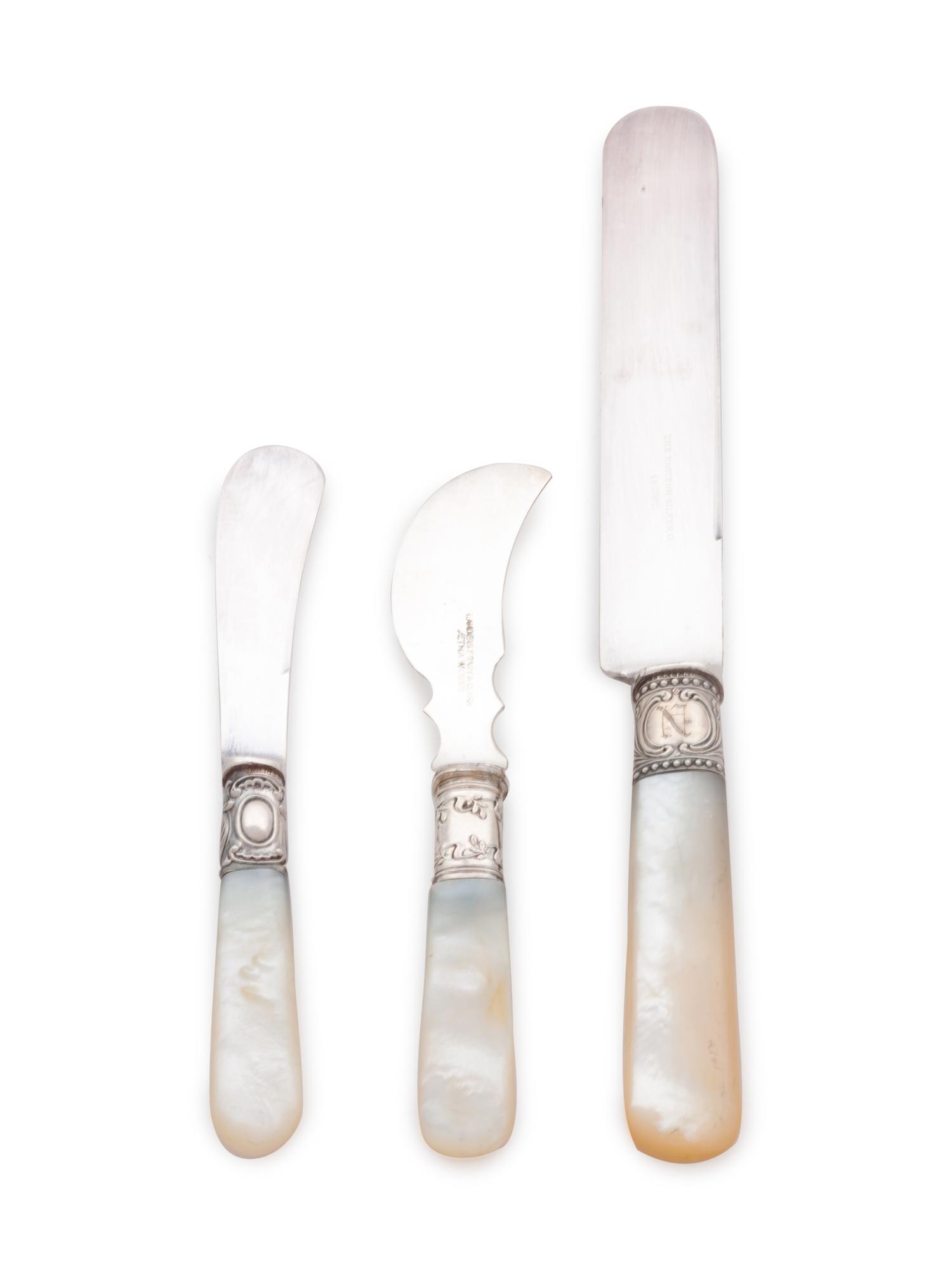 comprising: 6 Eastern Silver Co. dinner knives 6 Numsen Bros. butter spreaders 6 Landers Frary & Clark cheese knives 18 items total , each with stainless steel blades.